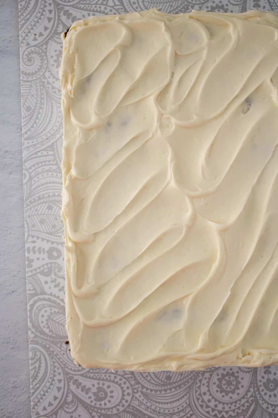 Cream cheese frosting on carrot cake