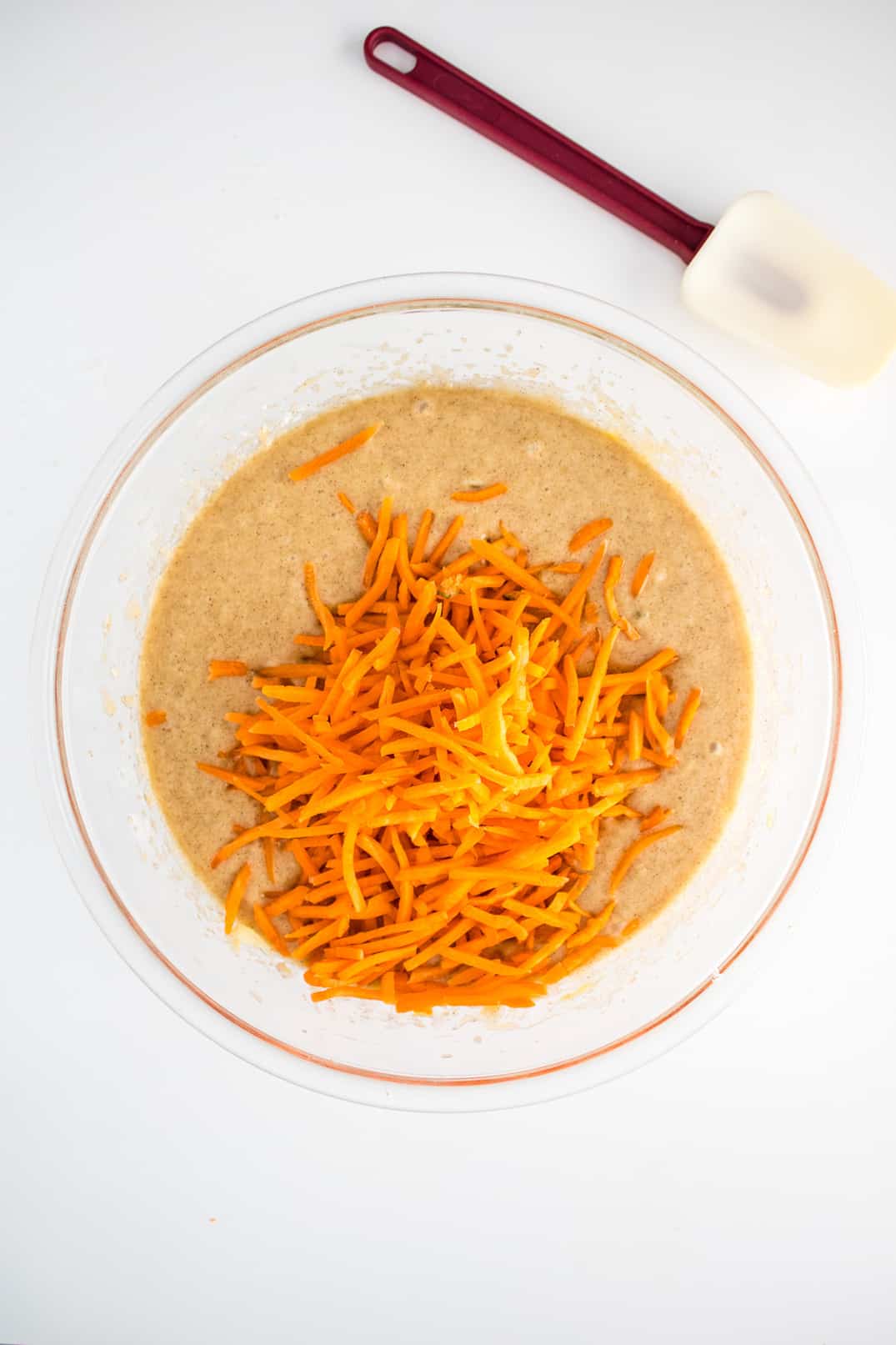 Adding shredded carrots to wet ingredients