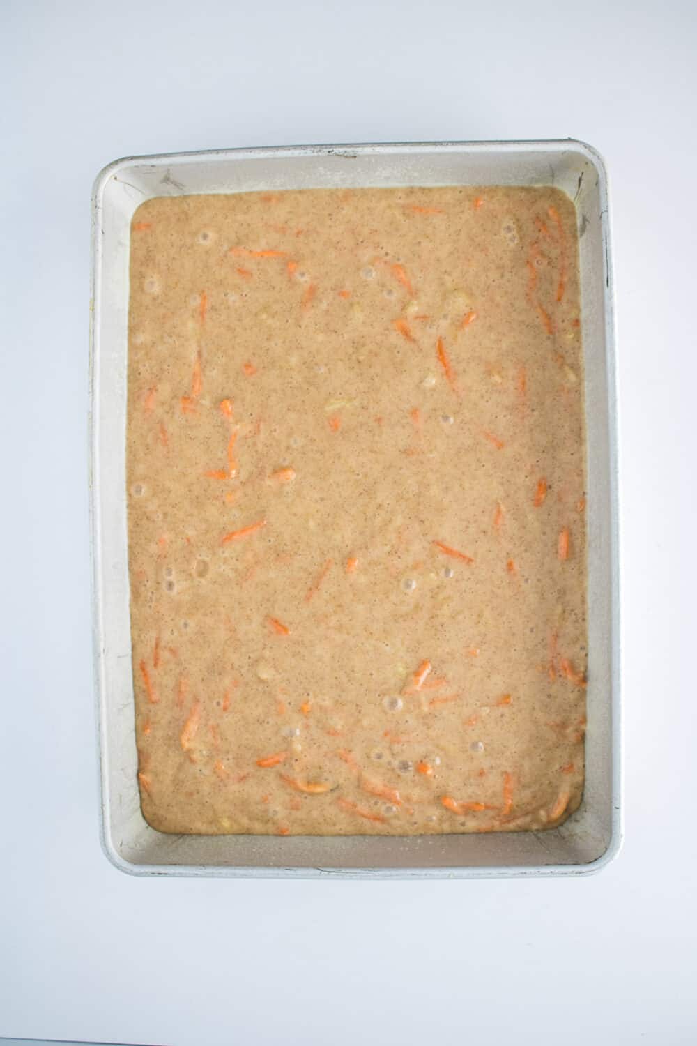Carrot cake batter in an 11 x 13 pan, ready to bake
