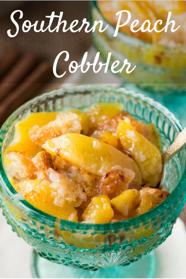 Peach cobbler in glass bowl with spoon