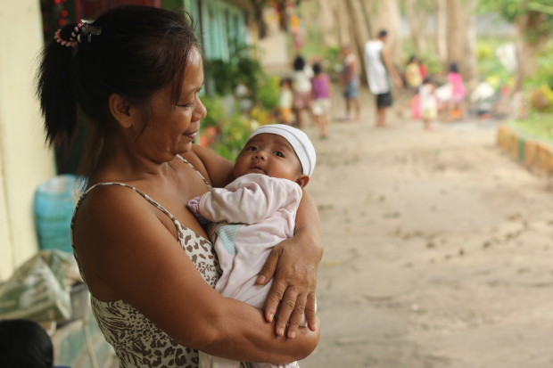 Mother Lusani, 29, couldn’t hide her fears while anticipating the coming of Typhoon Hagupit in her village. After learning about the news, her four children including her two-week old baby Shiely have evacuated to Sogod Central school along with more than a hundred families. Lusani’s family live along the riverside, which is, also quite near from the coast. “I worry about the coming days. I hope we can have something to eat and the evacuation center can withstand the storm,” she said. Lusani recently just gave birth and she’s still coping from her cesarean delivery. “I pray that God will give me the strength to protect my children,” she added. Her husband Remelio works as a security officer in the city. “I’m waiting for Remelio to go home. He can’t be absent to work yet because he might lost his job.”