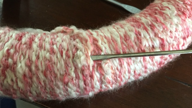 Tuck the yarn end in