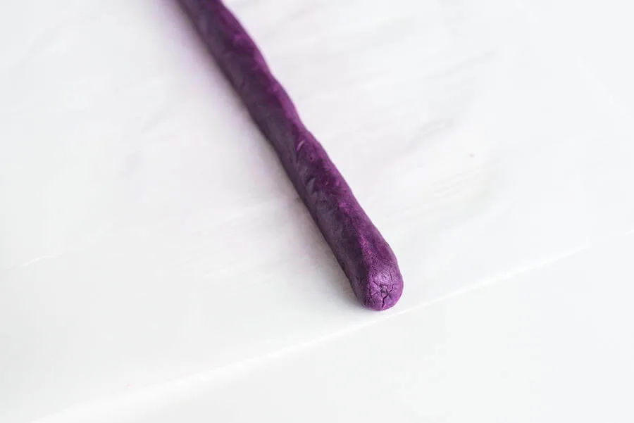 roll of purple dough for rainbow cookies