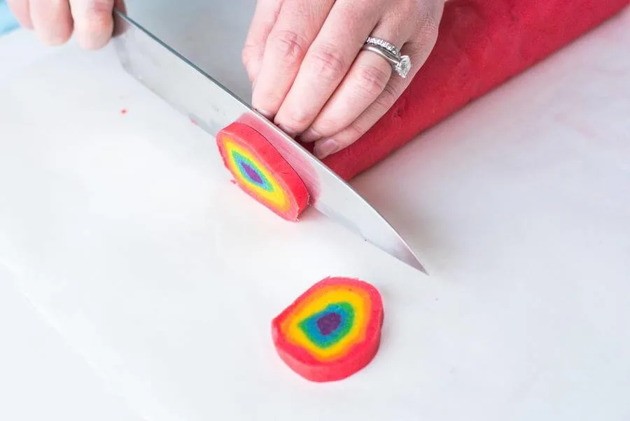 slicing rainbow cookie dough