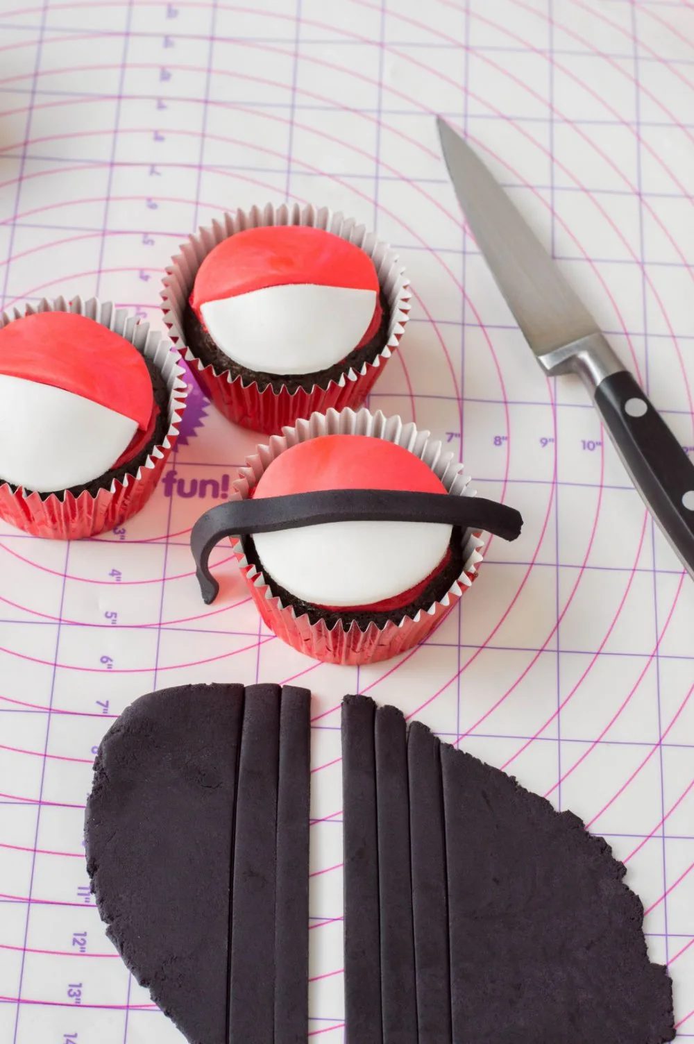 Adding black stripe to pokeball cupcakes
