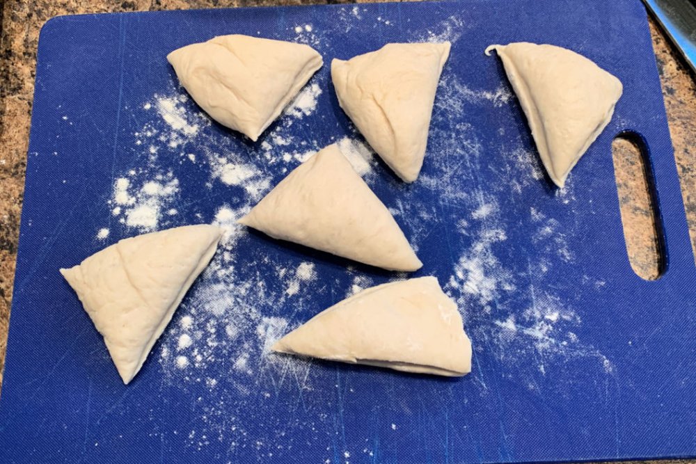 Cut the dough into 12 equal pieces