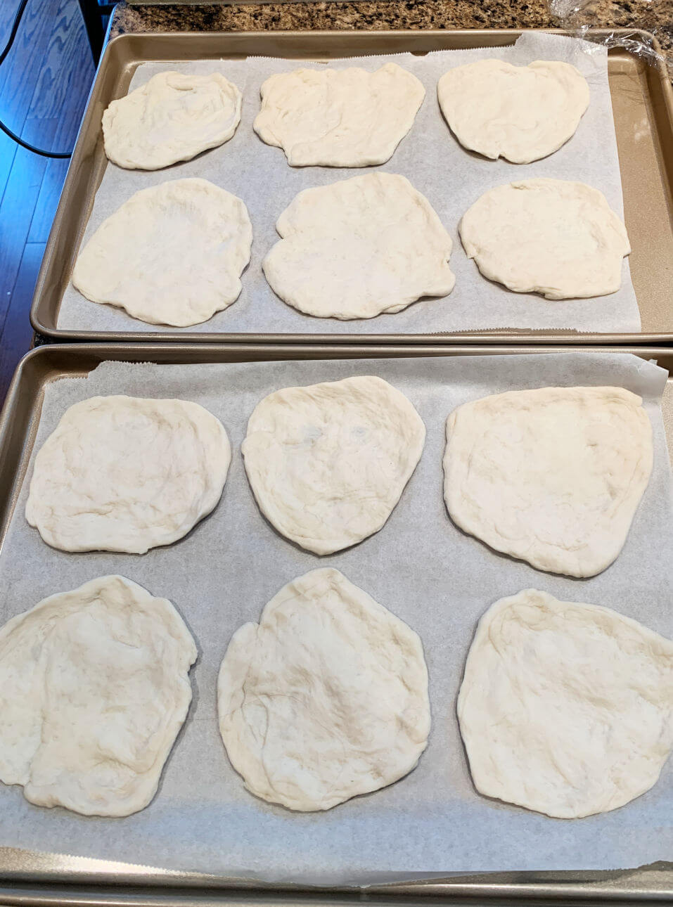 Stretch each piece of dough into a round