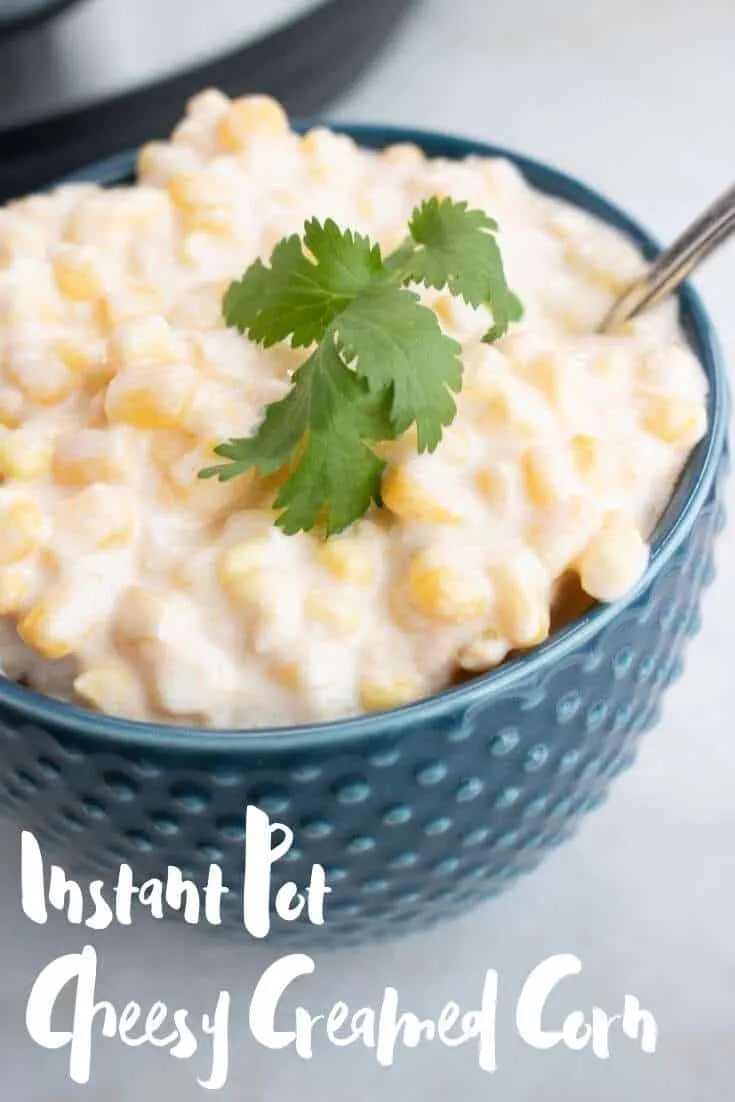 Instant pot cheesy creamed corn in a blue hobnail bowl