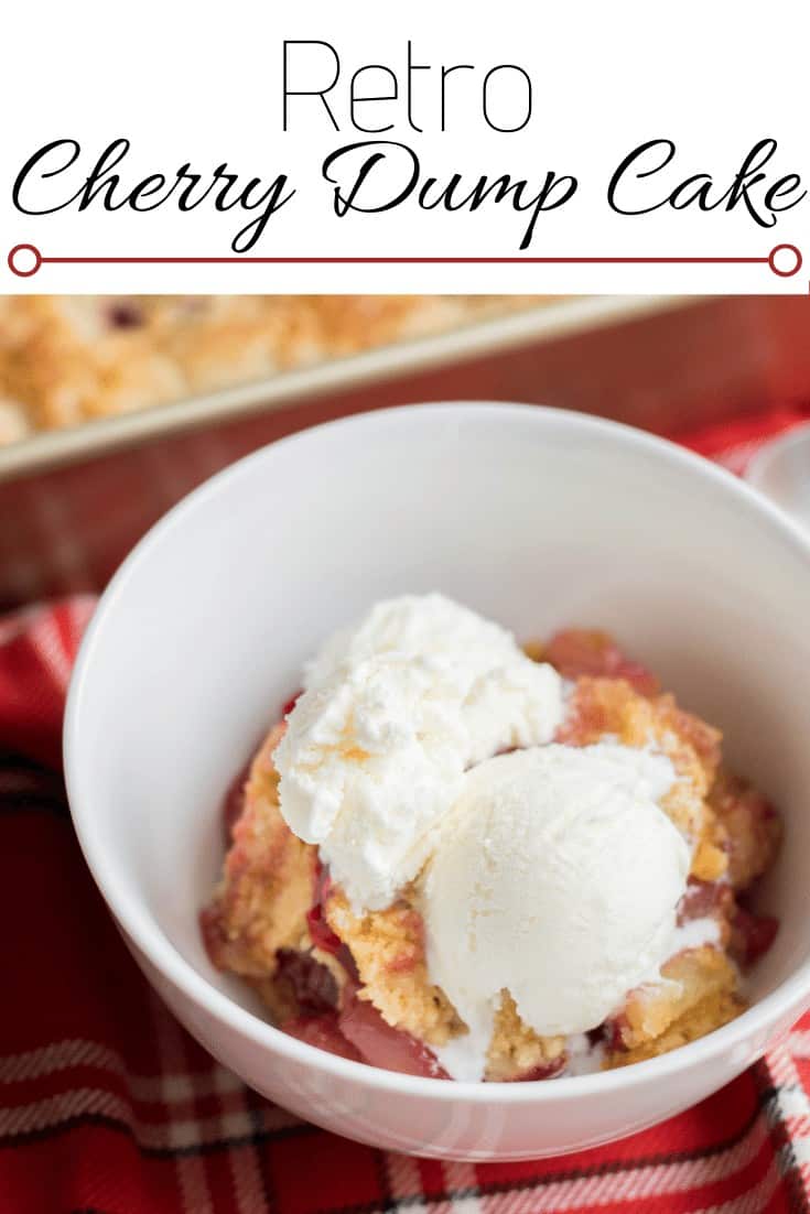 Cherry dump cake in a white bowl on a red table cloth.