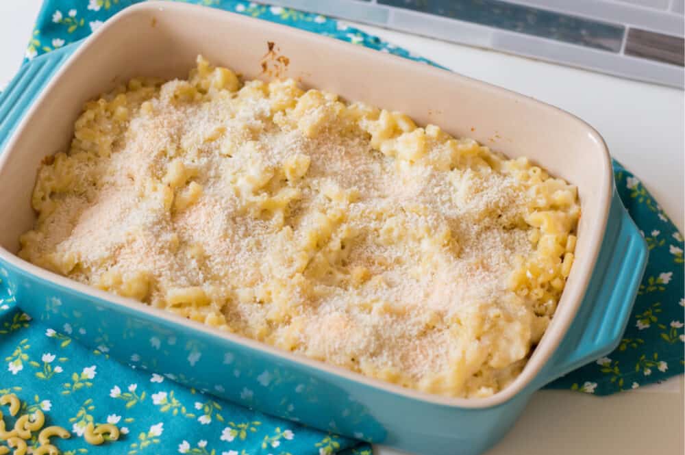 topping macaroni and cheese mixture with bread crumbs