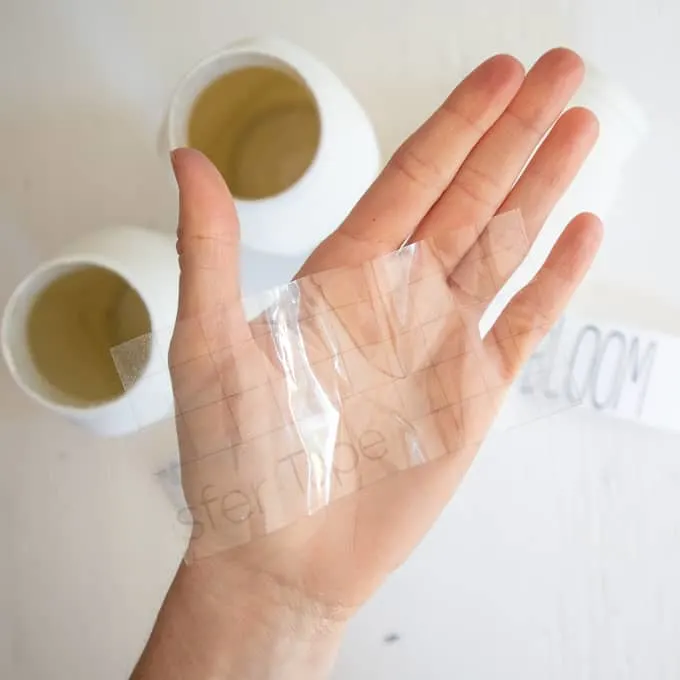 transfer tape on a person's hand