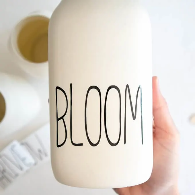 painted mason jar that says bloom 