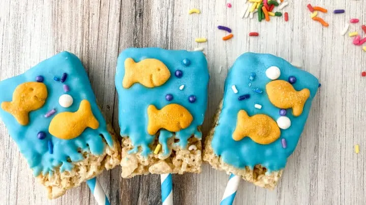 Dr. Seuss Rice Cereal Treats - a delicious dessert covered with blue candy melts and adorned with Goldfish crackers and sprinkles.