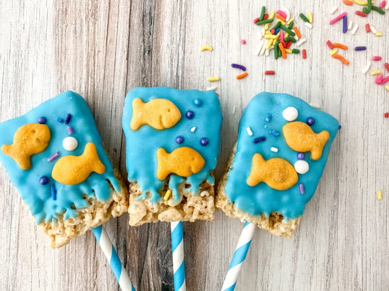 Dr. Seuss Rice Cereal Treats - a delicious dessert covered with blue candy melts and adorned with Goldfish crackers and sprinkles.