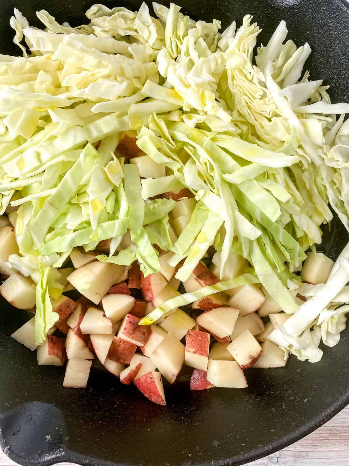 Sauteeing cabbage and potato mixture to start the filling for Irish Meat Pies