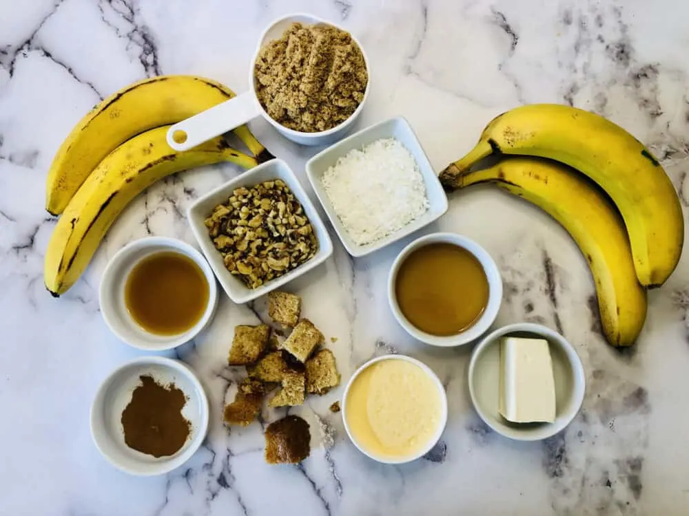 Ingredients laid out on a marble counter to make bananas foster