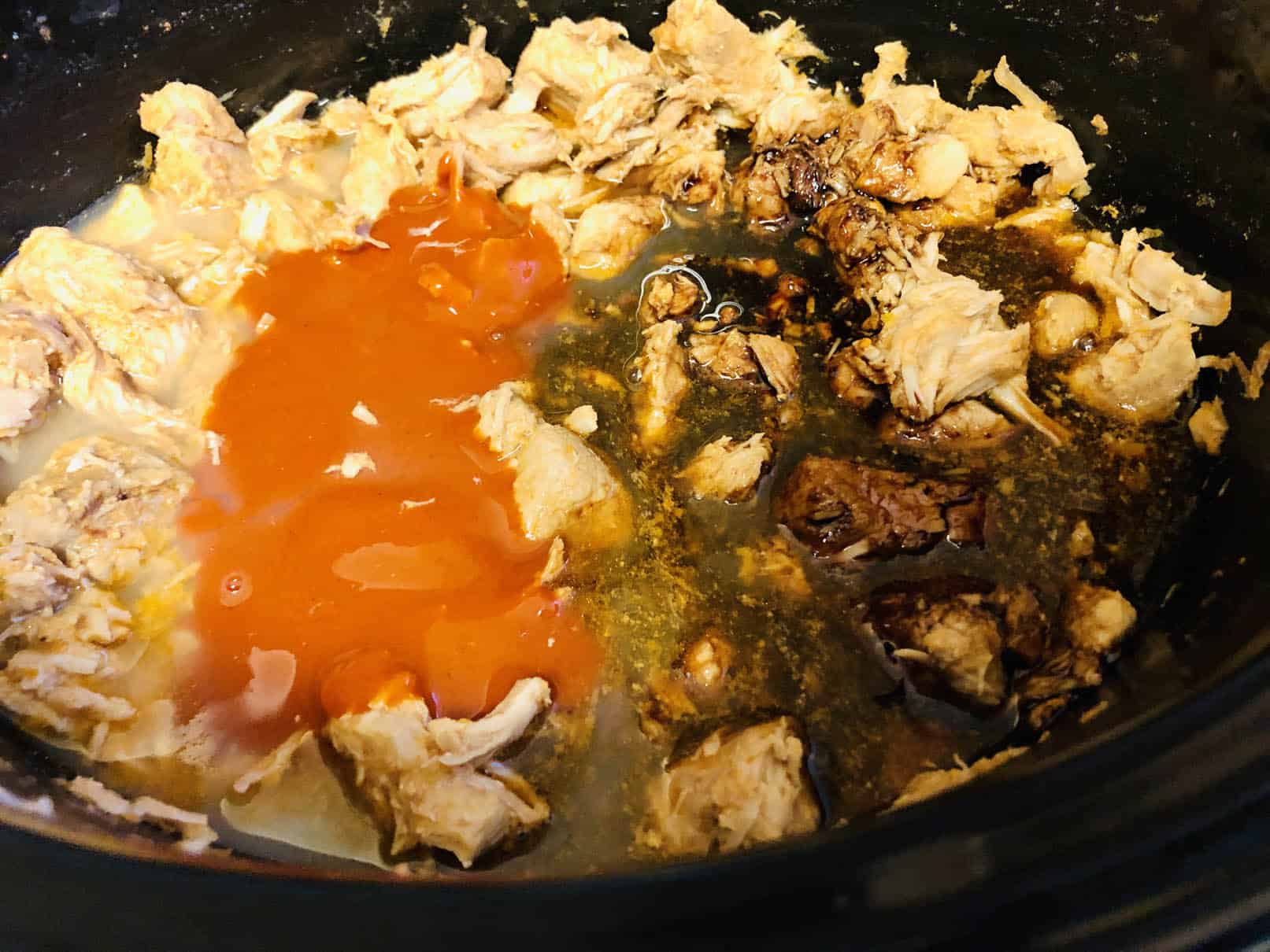 Adding sauces to cooked pork, cooked for 5 hours in a slow cooker