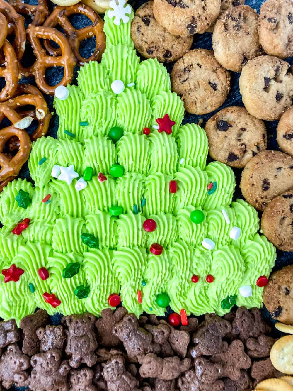 How adorable is this Holiday Frosting Board? Dive into a generous amount of green buttercream frosting with your favorite sweet snacks including mini cookies, pretzels, and graham crackers.