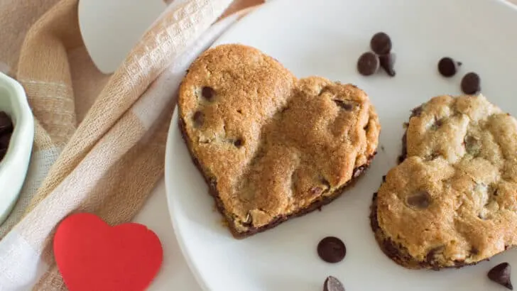 Treat your loved ones to a thematic treat this Valentine’s Day! My heart-shaped chocolate chip cookies are adorable, chewy, and filled with chocolate-y goodness.