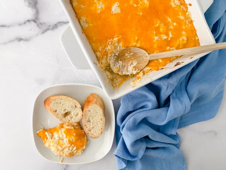 Completed Maryland Crab Dip with blue towel and baguette slices