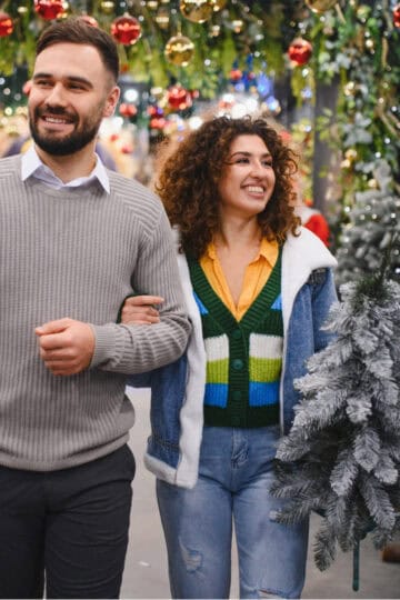 Couple walking through Christmas market