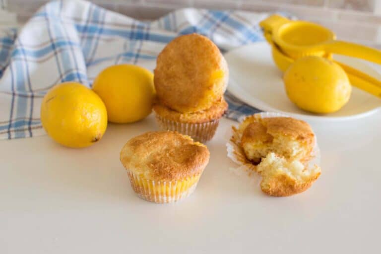 Discover the secret to bakery-style muffins at home! These Lemon Curd Muffins are bursting with flavor and feature homemade lemon curd and Greek yogurt for extra fluff.