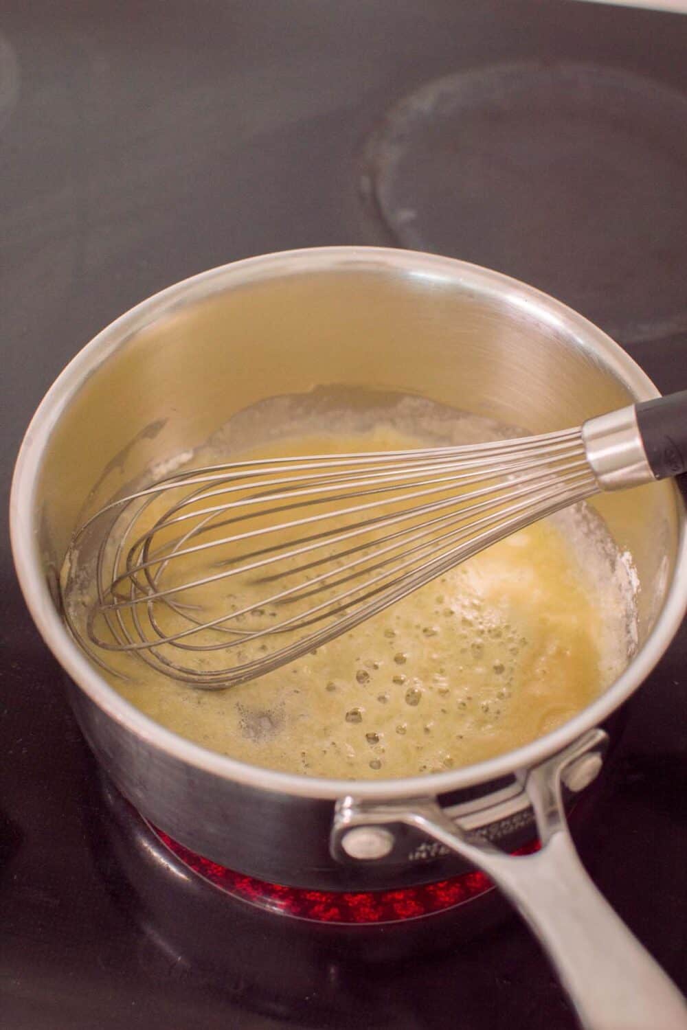 Melting butter and flour to start the process of making a roux