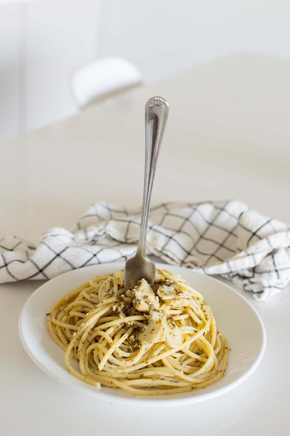 A fork about to take a biteful of Artichoke Pesto Pasta