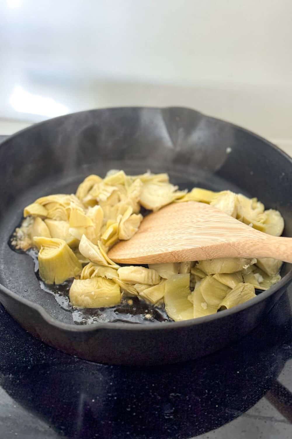 Cooking artichokes in an oil cast iron skillet