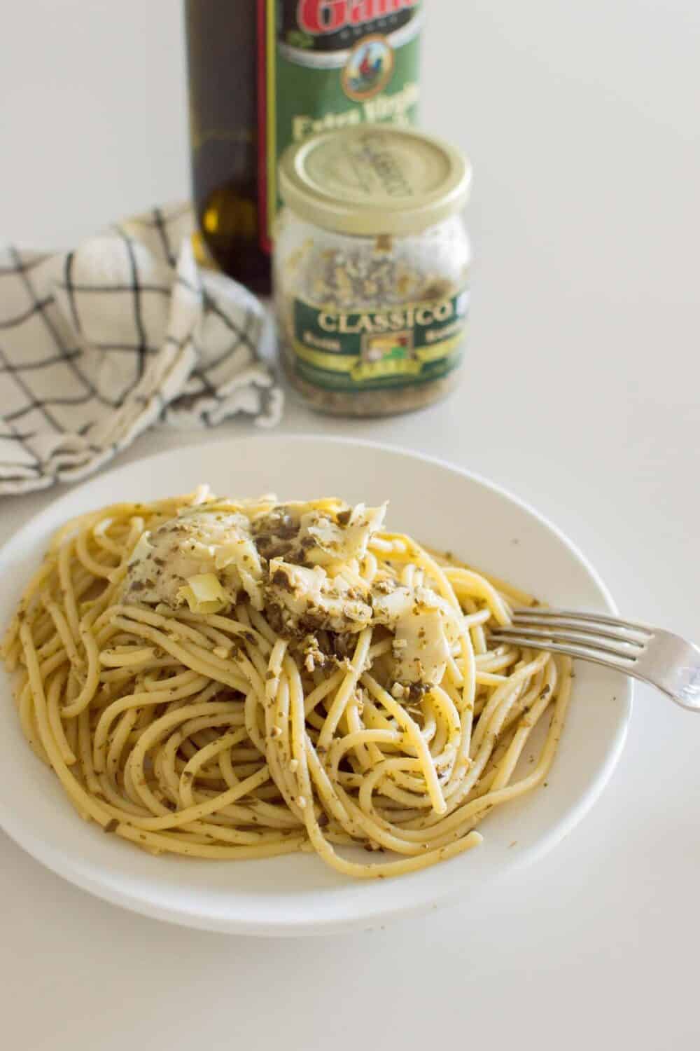 A fork about to take a biteful of Artichoke Pesto Pasta