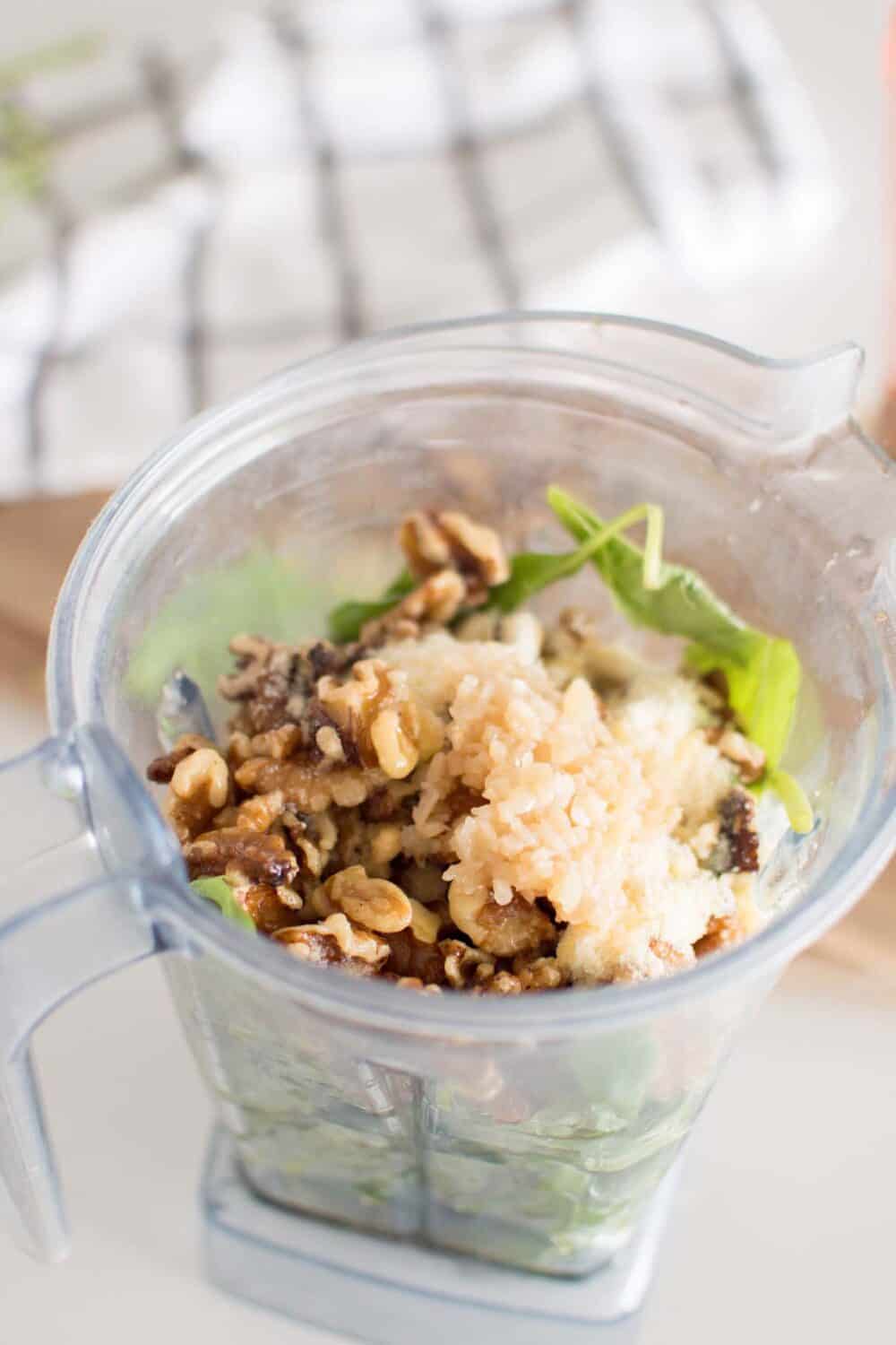Pesto ingredients in a blender before blending