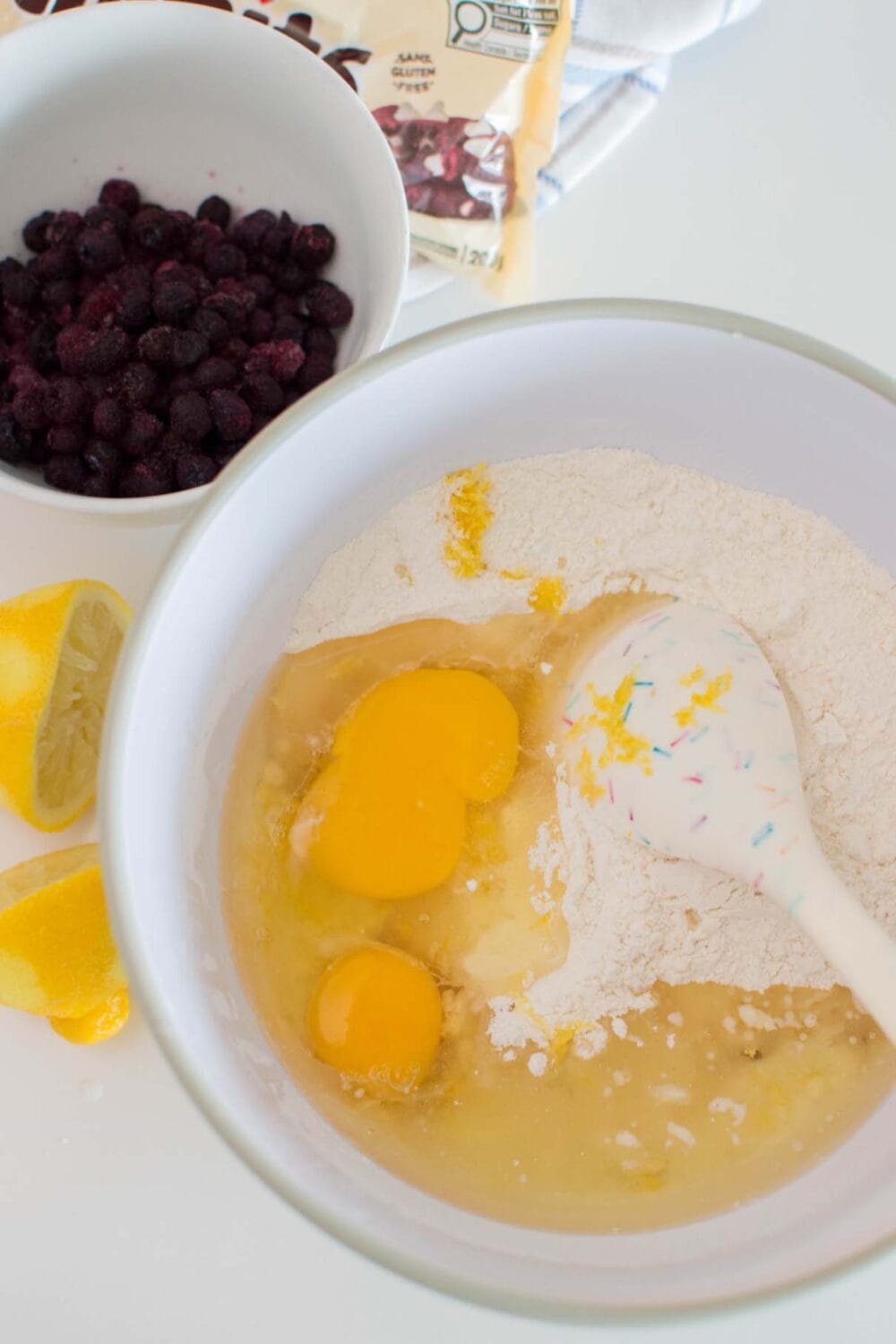 Adding wet ingredients to make the batter for Lemon Blueberry White Chocolate Muffins
