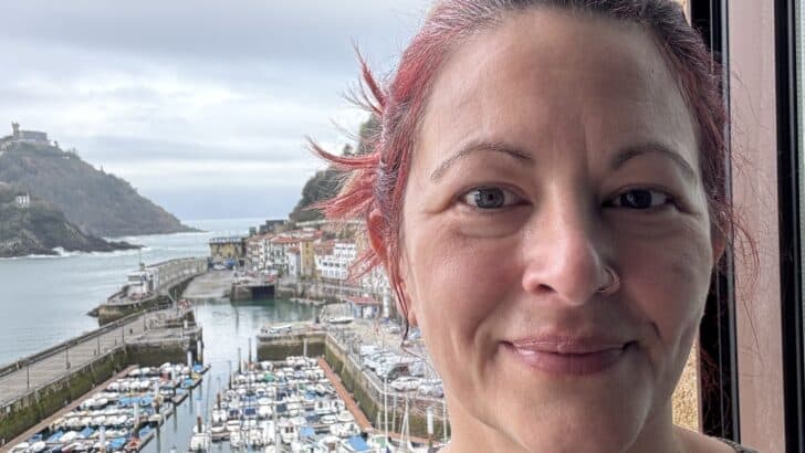 Woman in front of a marina