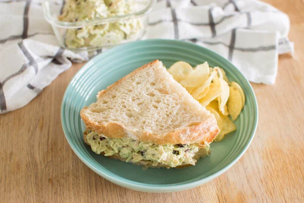 Homemade chicken salad sandwich with avocado ranch filling on a plate